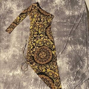 Elegant Asymmetrical Dress with Gold and Black Pattern